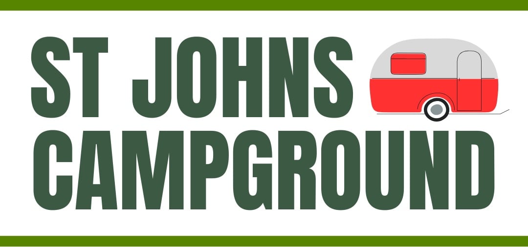 Sign reading "St Johns Campground" in green letters, with a red and gray camper trailer illustration on the right side.